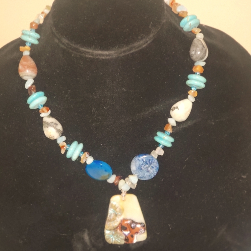 Natural chunky multi color genuine gemstone carved dog necklace.
